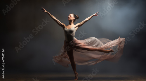 a beautiful young woman is dancing in a flowing and waving dress isolated on the background