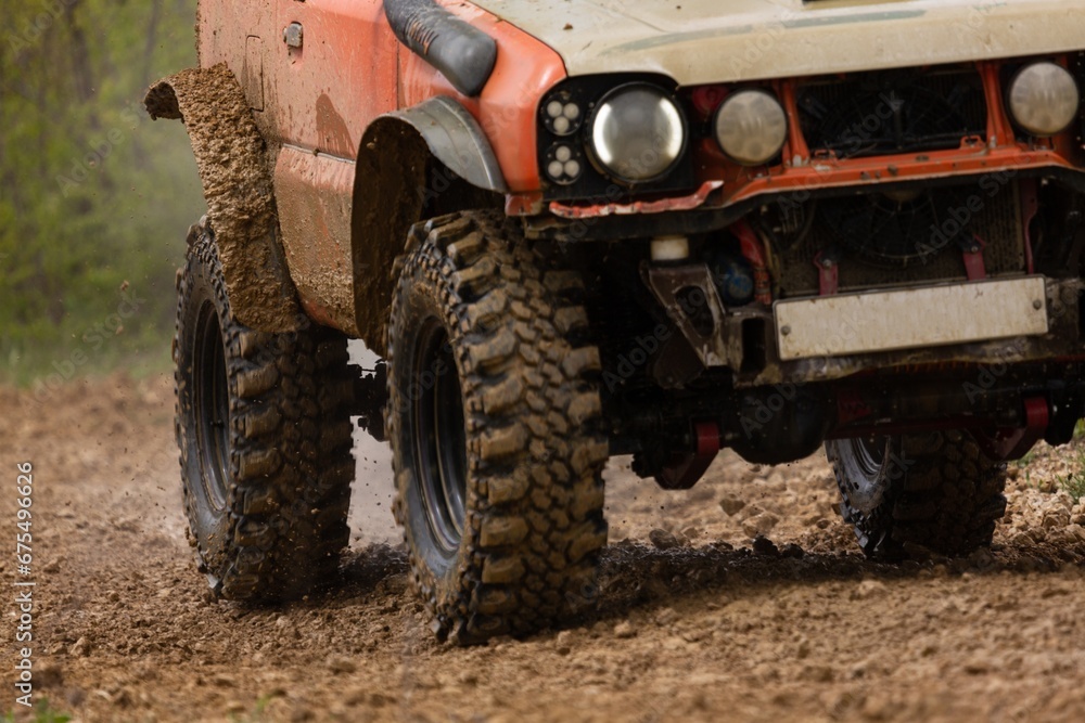 offroad car driving on track in dirt. adventure offroad racing