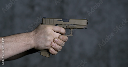 Принти на полотні Shooting with a Sig Sauer P320 9mm close-up pistol in super slow-motion 800 fps