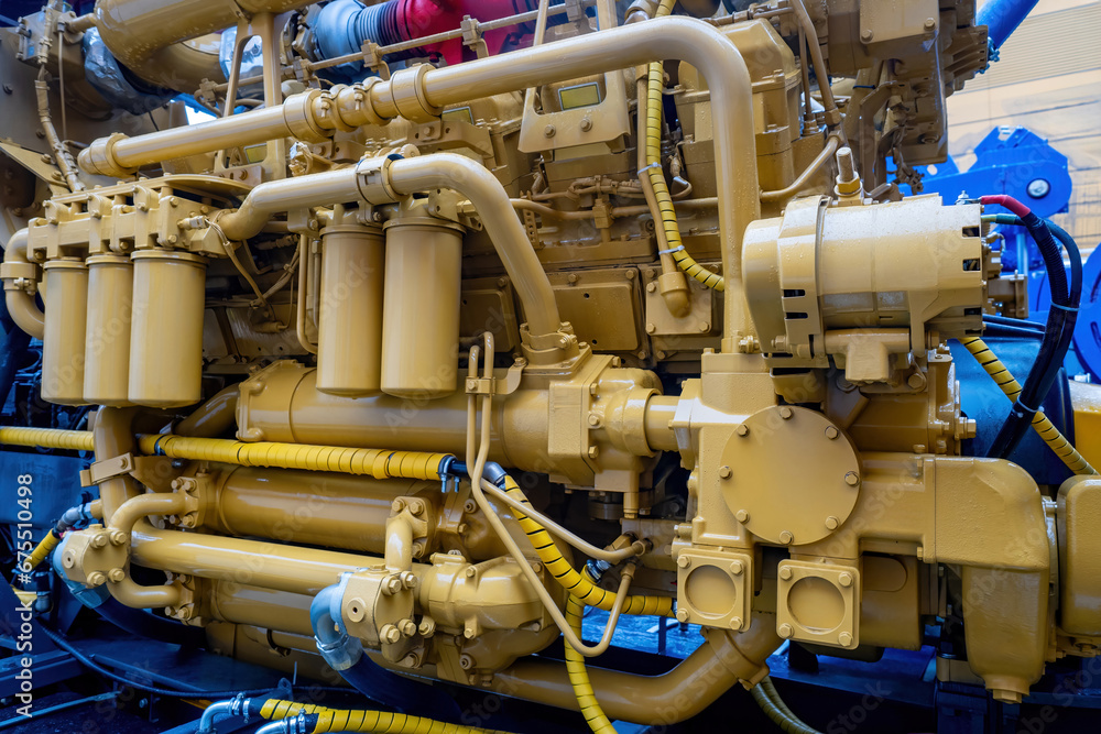 Marine diesel engine. Ship engine close-up. Industrial unit. Fragment of ship engine. Ship maintenance concept. Marine motor close-up. Repair and maintenance of spare parts for boats