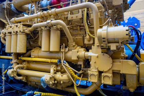 Marine diesel engine. Ship engine close-up. Industrial unit. Fragment of ship engine. Ship maintenance concept. Marine motor close-up. Repair and maintenance of spare parts for boats
