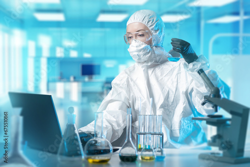Woman chemist. Girl is empl...