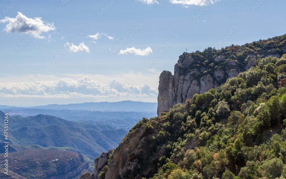 Scenic view of St Michael's Cross at Montserrat mountains in Spain