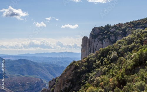 Scenic view of St Michael's Cross at Montserrat mountains in Spain