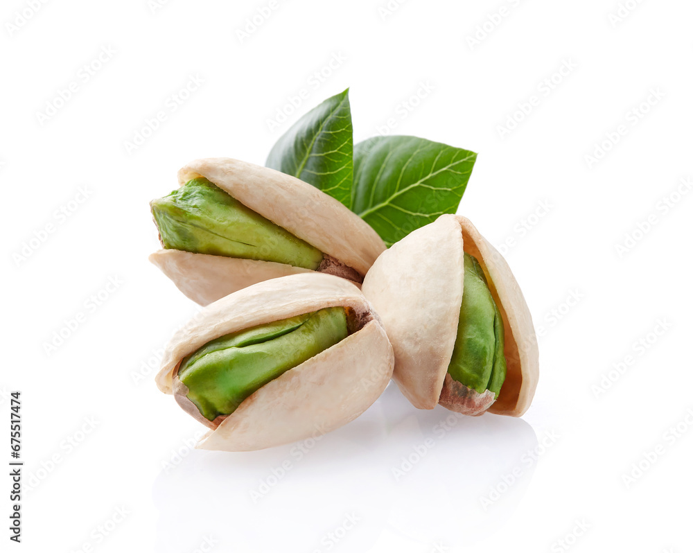 Pistachio with leaves on white background Pistachio with leaves on white background