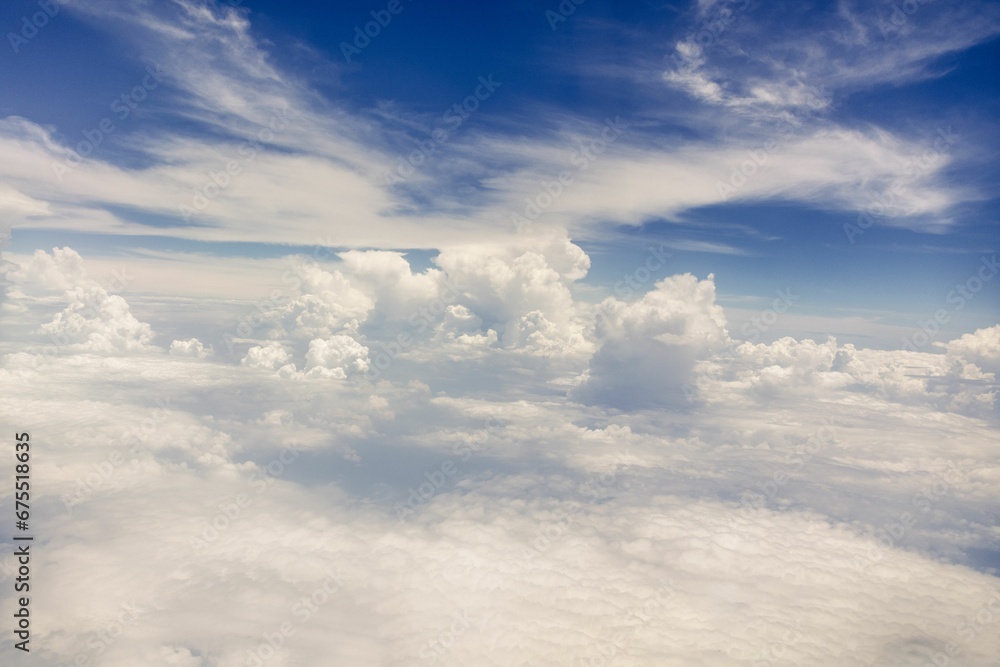 Fototapeta premium Aerial view of a clear sky with scattered clouds