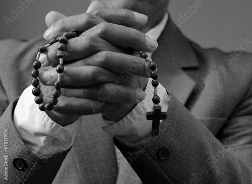 black man praying to god on gray background with people stock image stock photo 