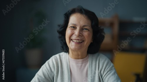 Portrait happy smiling laughing senior brunette woman looking at camera. Friendly old lady, mature positive female sitting enjoying life. Pensioner retiree lifestyle, sincere human emotions concept. photo