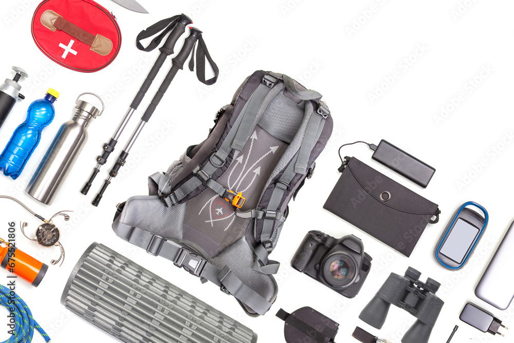 Set of tourist trekking items on white background. Top view of accessories for travel. Equipment for travel and hiking. Survival Items. Set of tourist trekking items on white background. Top view of accessories for travel. Equipment for travel and hiking. Survival Items.