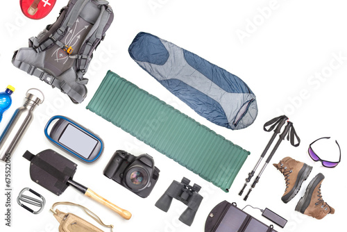 Set of tourist trekking items on white background. Top view of accessories for travel. Equipment for travel and hiking. Survival Items.