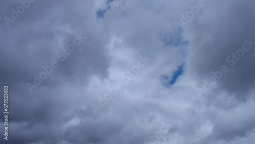 Dark clouds overshadow the cloudy sky