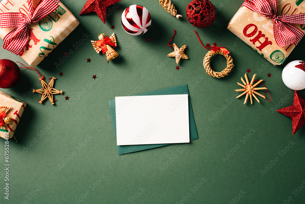 Christmas letter mockup with festive gift boxes and retro ornaments on a green backdrop