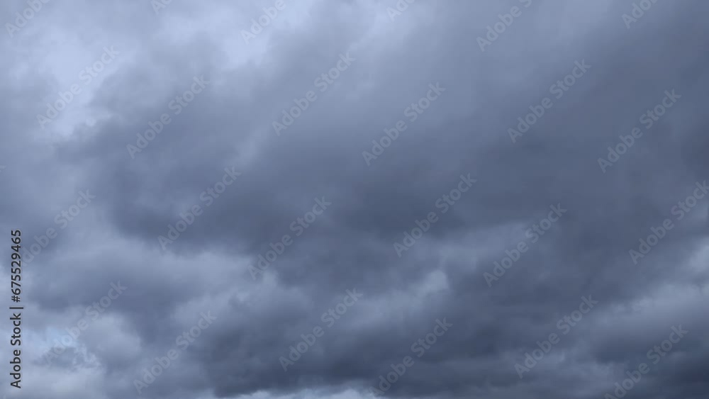 Gray stratocumulus cloud moves across the sky Gray stratocumulus cloud moves across the sky
