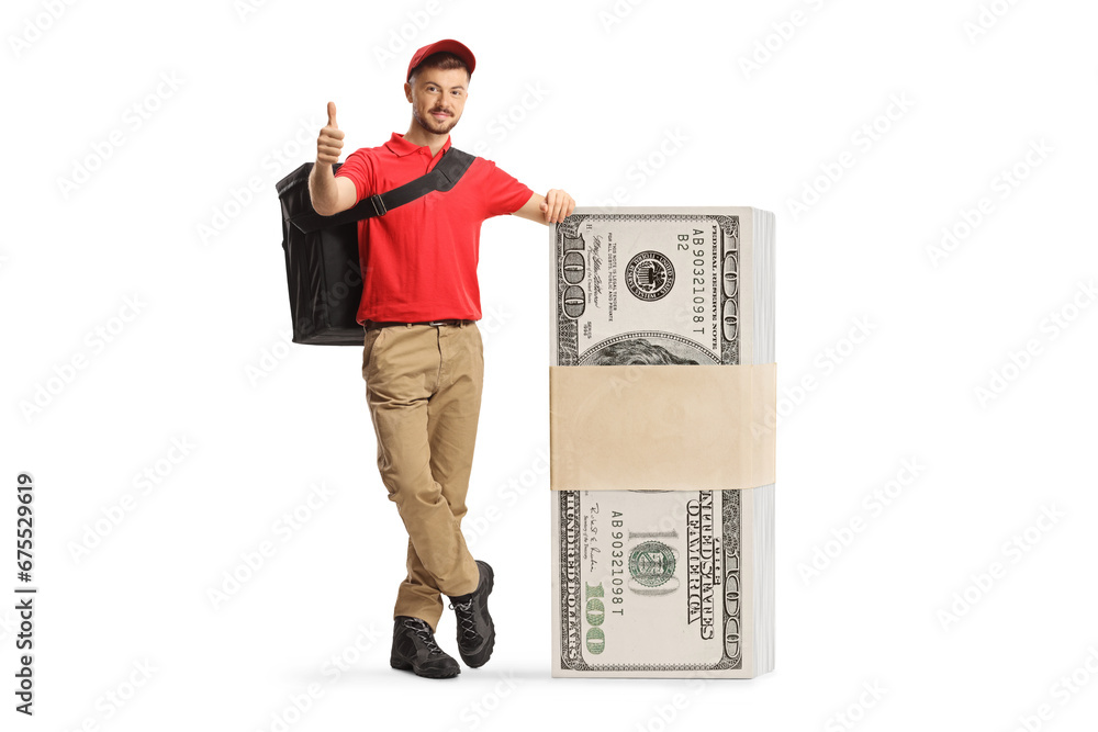 Delivery man leaning on a stack of money and gesturing thumbs up Delivery man leaning on a stack of money and gesturing thumbs up