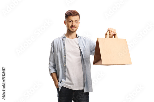 Young man holding a takeaway food bag