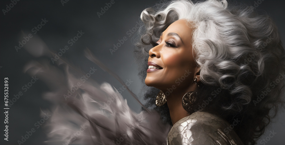 Black adult woman touch face with smooth healthy skin. Beautiful aging mature woman with long gray hair and happy shy smiling. Beauty and cosmetics skincare advertising concept