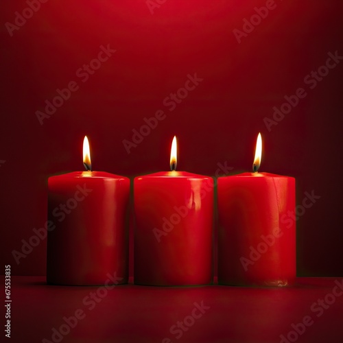A Heap of Red Cylindrical Christmast Wax Candles Stacked one on top of another in a Simple Red Room Illuminating it.