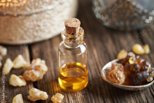 Wallpaper Mural A bottle of frankincense essential oil with frankincense resin Torontodigital.ca