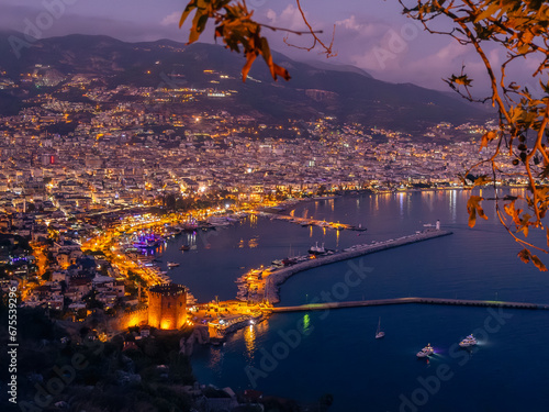 View from Alanya castle to the harbor at night, city lights at evening, Night Photography. photo