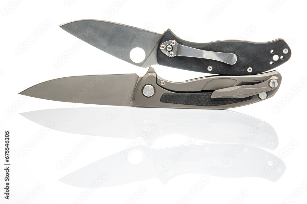 two folding knives on a white background. item for tourism and survival.