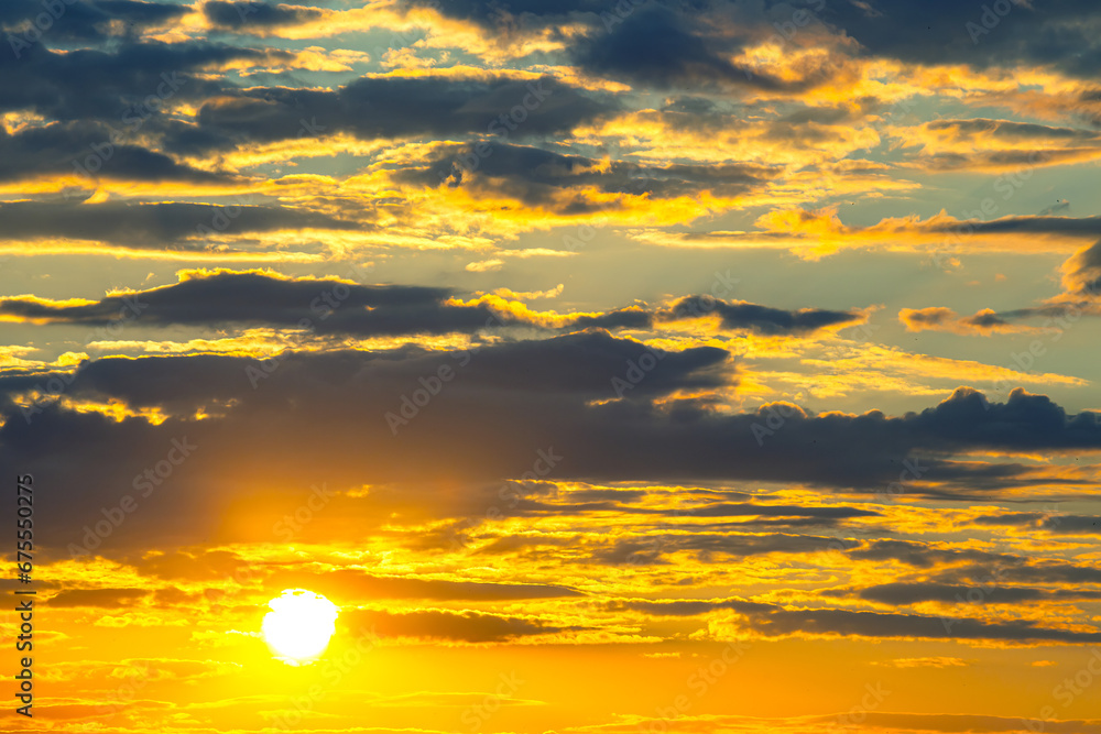 brightly colorful clouds in the evening sky. Lush colored clouds in the sky before sunset. dawn in the clouds