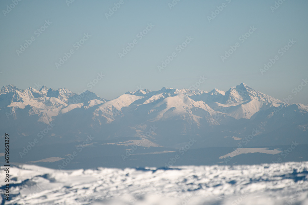 Amazing view of mountain peaks covered with snow. Snowy mountains in winter day