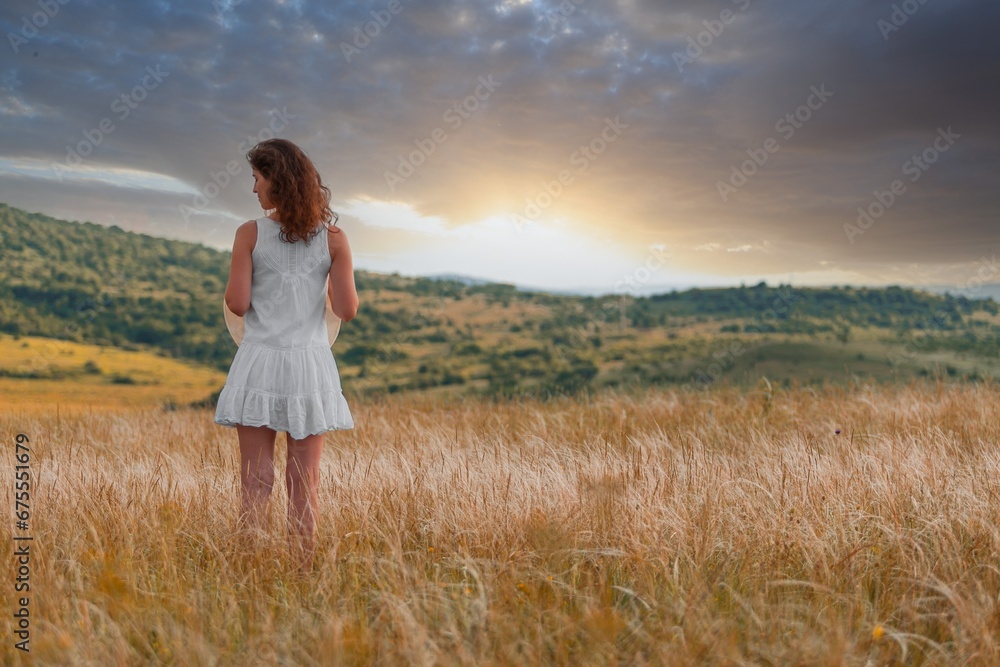 Woman on field wheat with sunset background Woman on field wheat with sunset background