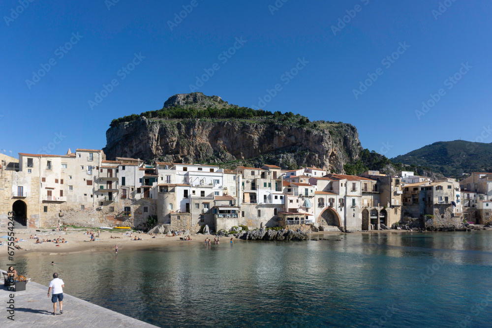 Cefalú,Sicily, Italy,18th October 2019. The old town of Cefalú set against the rocky crag of La Rocca, where there are  the remains of old medieval castle.