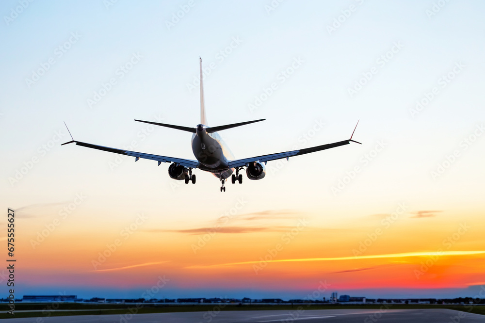 Passenger aircraft landing approach to the airport. Airplane flight in the sky.