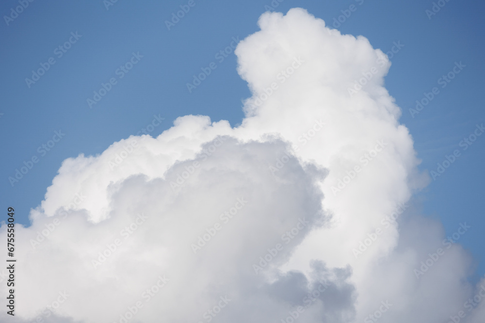 white cumulus clouds in blue sky, beautiful view of the sky and storm clouds. Huge majestic cloud phenomena. nature atmosphere ecology weather. Storm warning, weather change before storm thunderstorm white cumulus clouds in blue sky, beautiful view of the sky and storm clouds. Huge majestic cloud phenomena. nature atmosphere ecology weather. Storm warning, weather change before storm thunderstorm