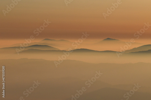 Beautiful view on winter landscapes in foggy mountains covered with clouds