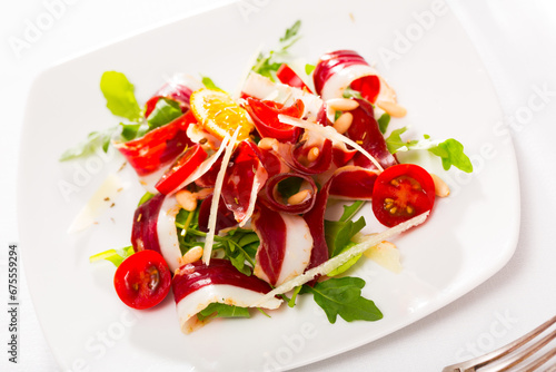 Delicious poultry dish - fresh salad with dried duck breast Magret