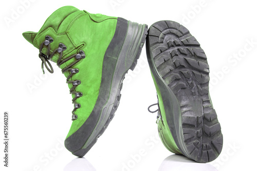Trekking boots for hiking on a white background. Equipment for travel and hiking © photosaint