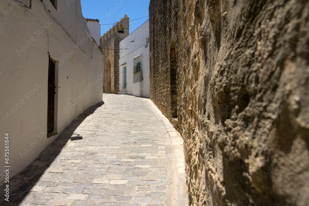 City stone walls in the old town of the white beautiful village of Vejer de la Frontera in a sunny day, Cadiz province, Andalusia, Spain