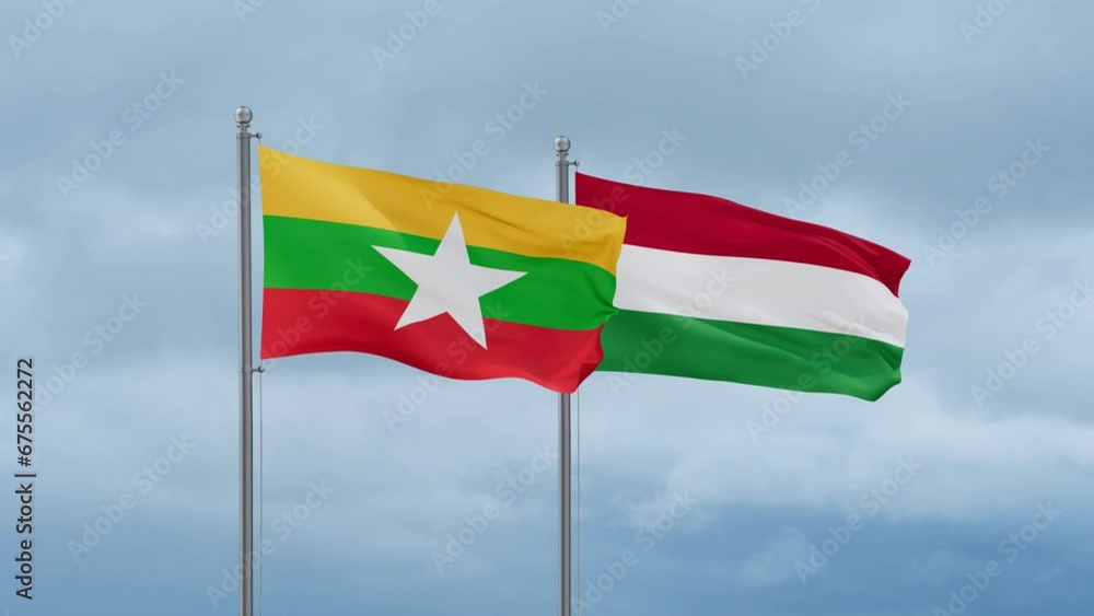 Hungary flag and Myanmar flag waving together on cloudy sky, endless seamless loop, two country relations concept Hungary flag and Myanmar flag waving together on cloudy sky, endless seamless loop, two country relations concept