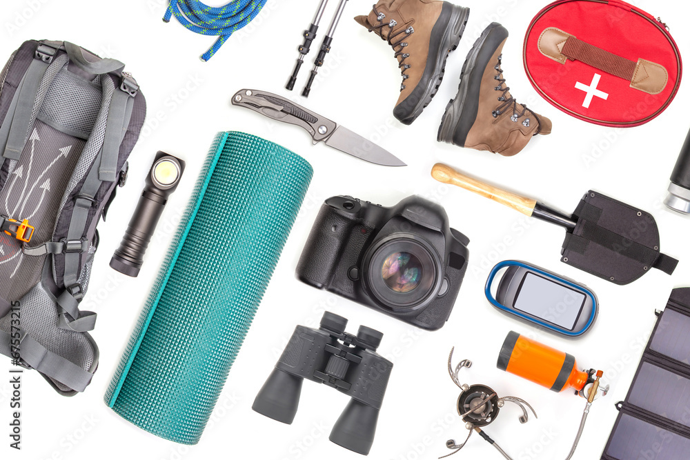 Set of tourist trekking items on white background. Top view of accessories for travel. Equipment for travel and hiking. Survival Items. Set of tourist trekking items on white background. Top view of accessories for travel. Equipment for travel and hiking. Survival Items.