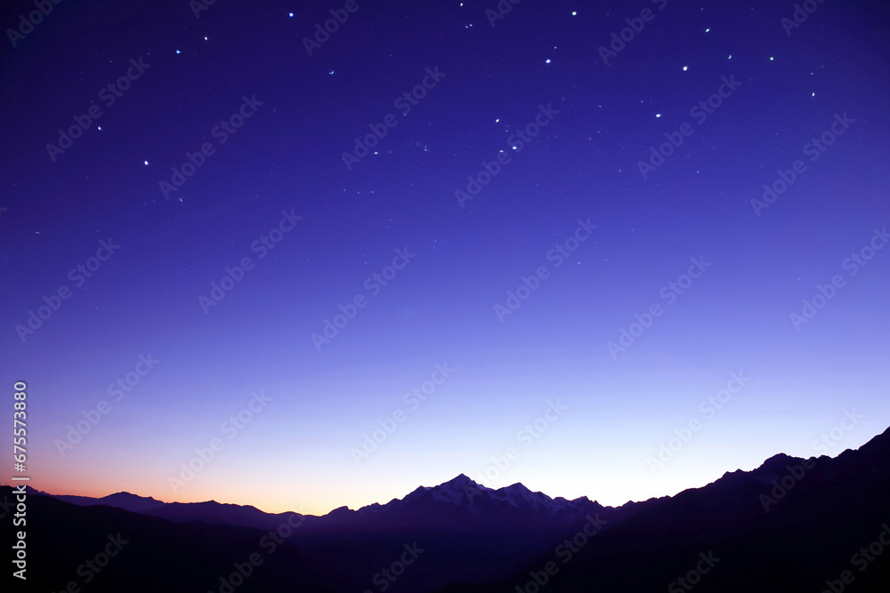 the starry sky in the mountains before the morning dawn. astronomy and planetary observation