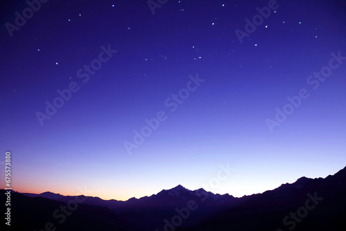 the starry sky in the mountains before the morning dawn. astronomy and planetary observation