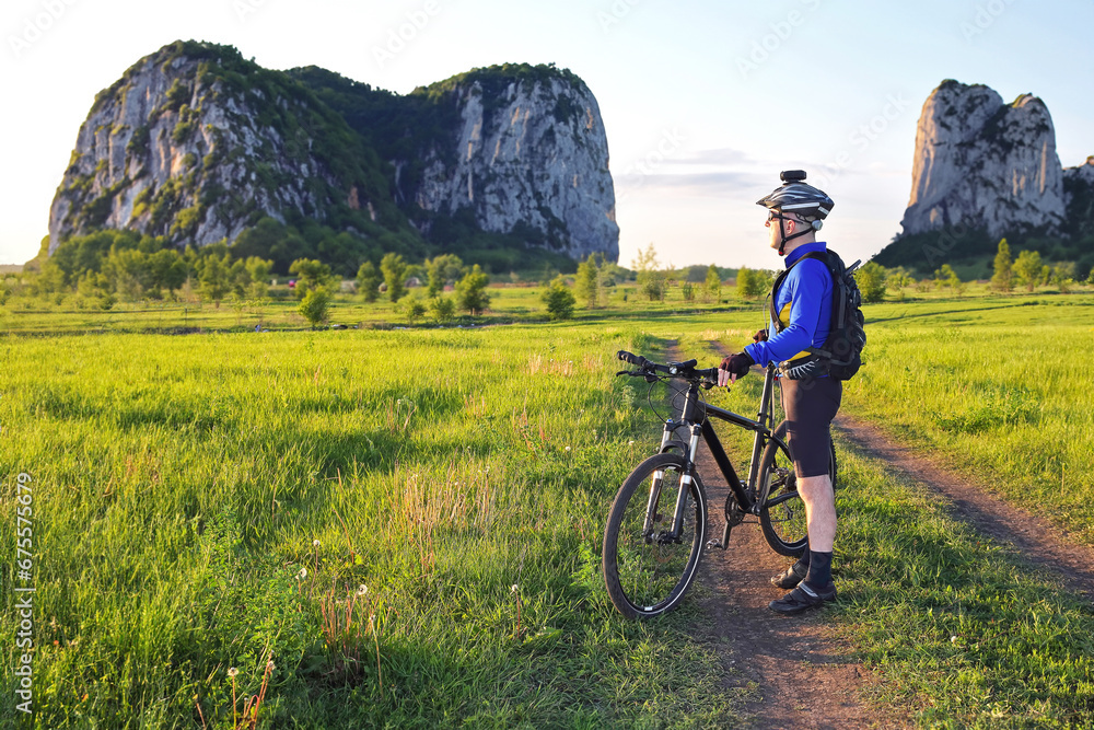 Fototapeta premium cyclist with a bike in the sun.
