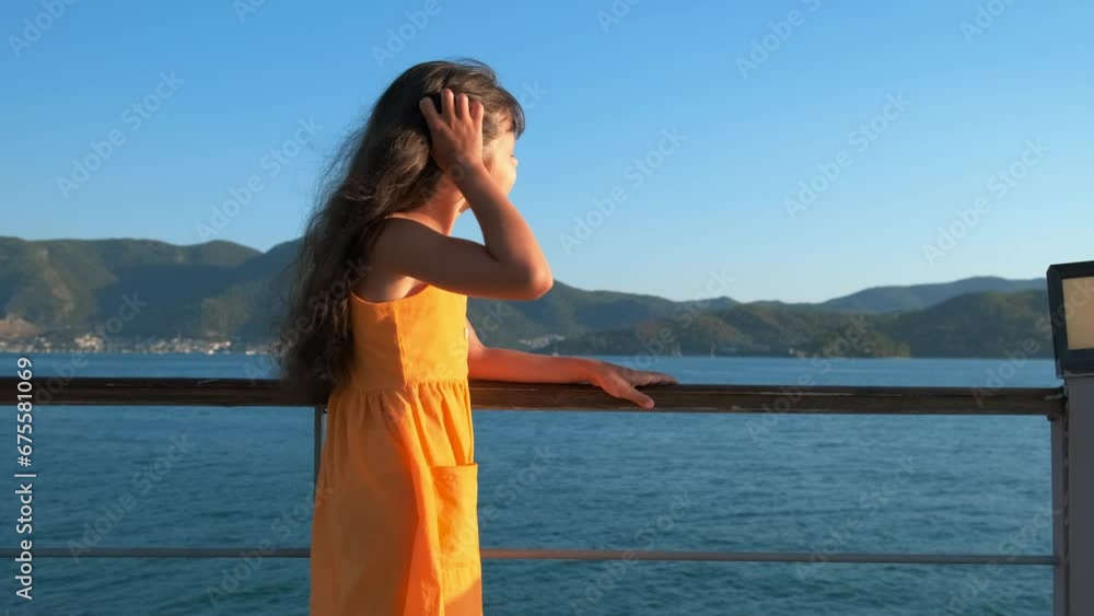 Happy feeling against blue sea. A nice little girl have happy feeling during sea rest on the pier under sun. Happy feeling against blue sea. A nice little girl have happy feeling during sea rest on the pier under sun.