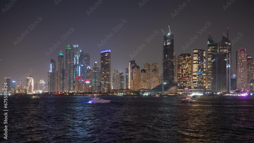 night illumination dubai marina city famous island bay water traffic panorama 4k timelapse uae