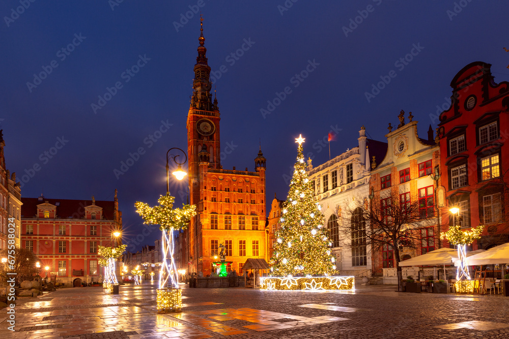 Belfry tower above the old medieval town hall at the Long market at Christmas night, Gdansk, Poland.