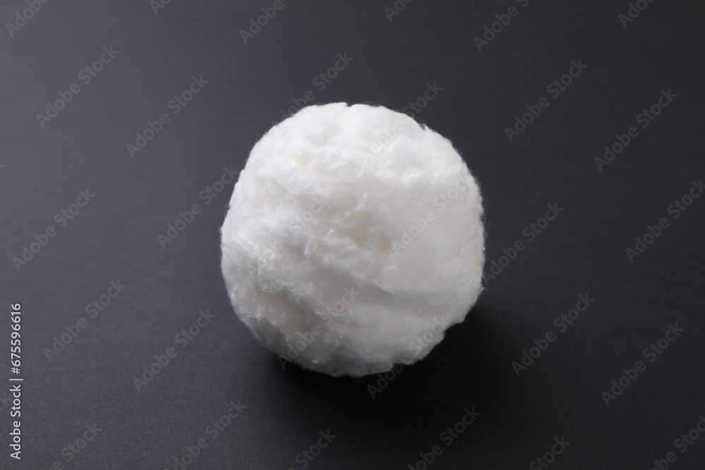 Ball of clean cotton wool on grey background, closeup