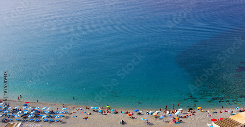 Bathers on the beach in Scilla Calabria Italy photo