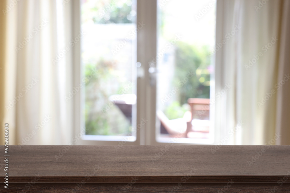 Empty wooden table in room, blurred interior. Space for design Empty wooden table in room, blurred interior. Space for design