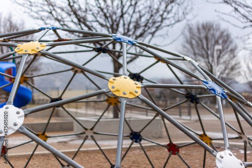 Fotografie A metal jungle gym at a public playground on an overcast wintry day