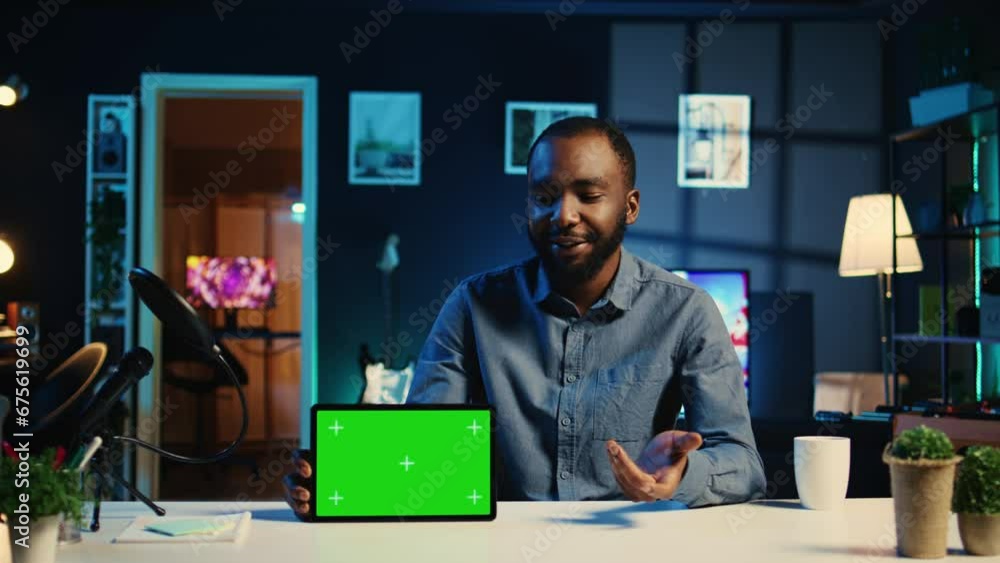 Tech media star filming chroma key tablet unboxing , giving reasons to purchase it. Influencer capturing video urging subscribers to buy sponsoring partner isolated screen digital device Tech media star filming chroma key tablet unboxing , giving reasons to purchase it. Influencer capturing video urging subscribers to buy sponsoring partner isolated screen digital device
