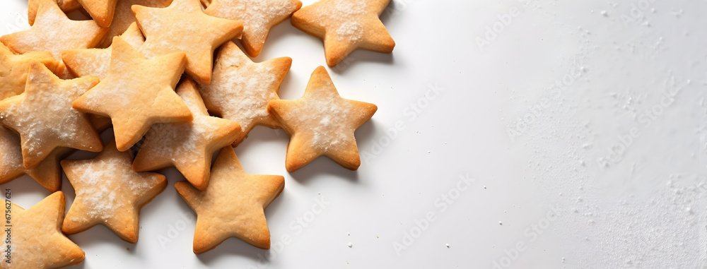 Top down view of baked star shaped Majorcan crespells cookies pile on white surface. Traditional Easter and Holy Week cooked sweet pastries stack from gastronomy of Mallorca, Balearic Islands, Spain. Top down view of baked star shaped Majorcan crespells cookies pile on white surface. Traditional Easter and Holy Week cooked sweet pastries stack from gastronomy of Mallorca, Balearic Islands, Spain.