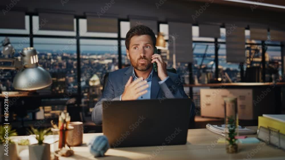 Man director arguing cellphone evening workplace closeup. Businessman gesturing Man director arguing cellphone evening workplace closeup. Businessman gesturing