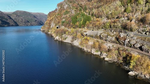 Railway and road E16 with tunnels at Hetteneset near Stanghelle, Norway photo